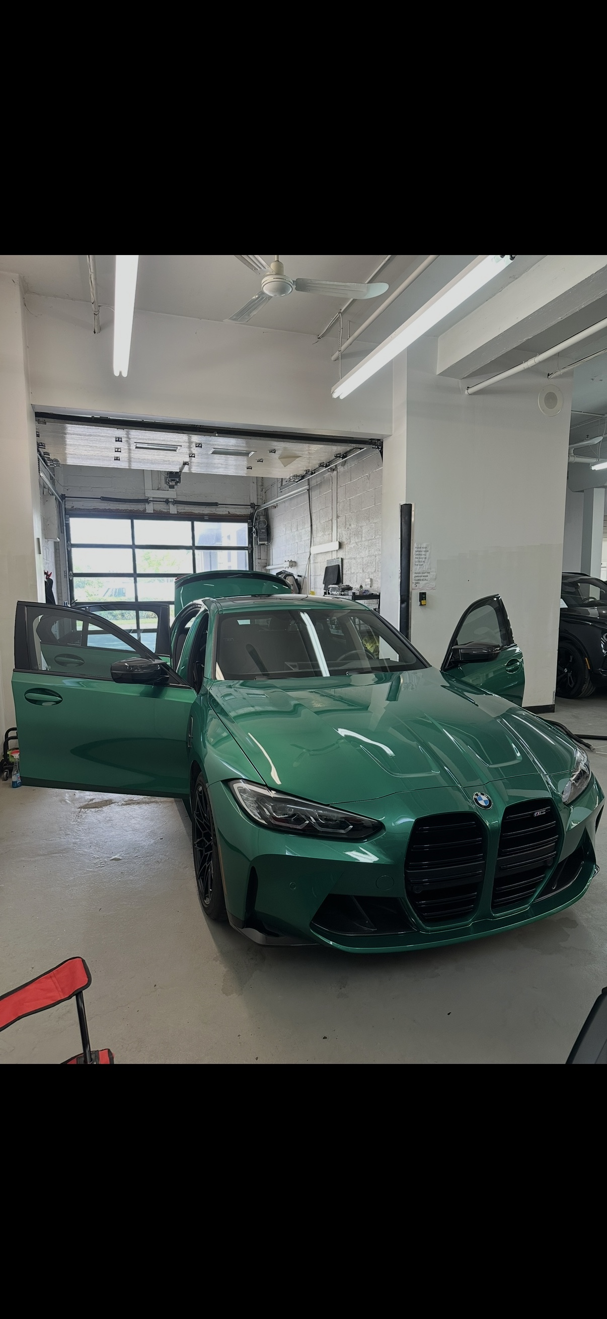 Green BMW M3 inside the Paramount Details workshop