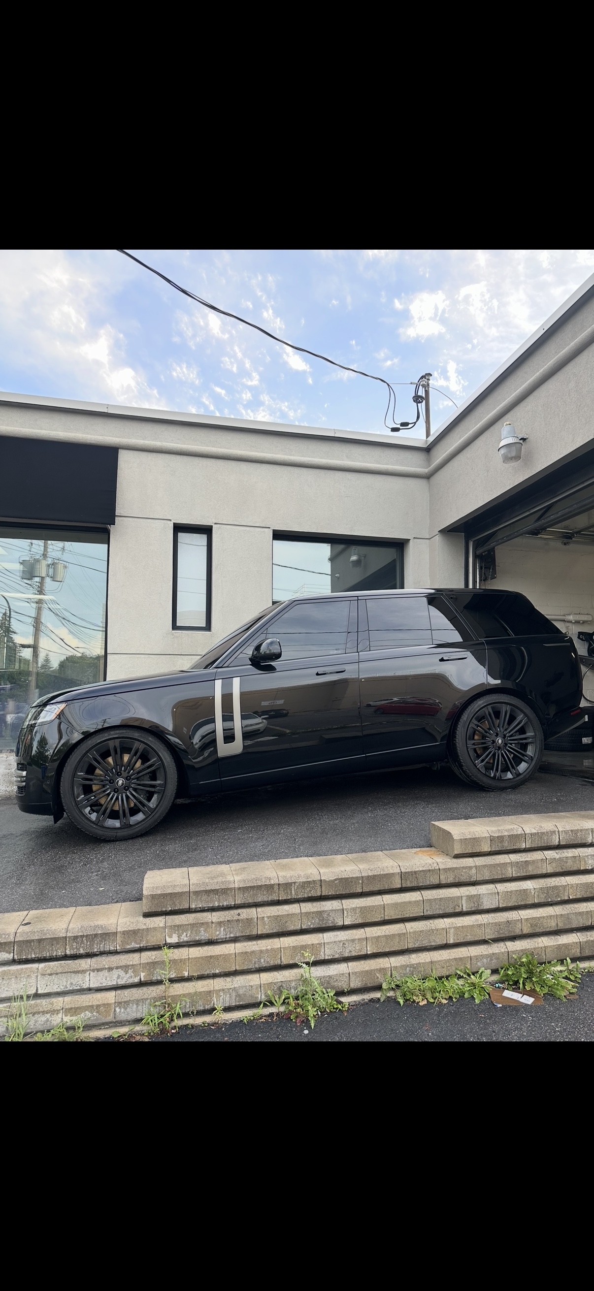Black Range Rover outside the Paramount Details workshop